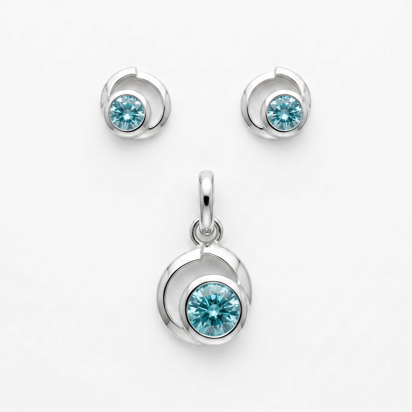 925 Silber Schmuckset mit Zirkonium Hellblau im Spiralen-Design – Anhänger und Ohrringe