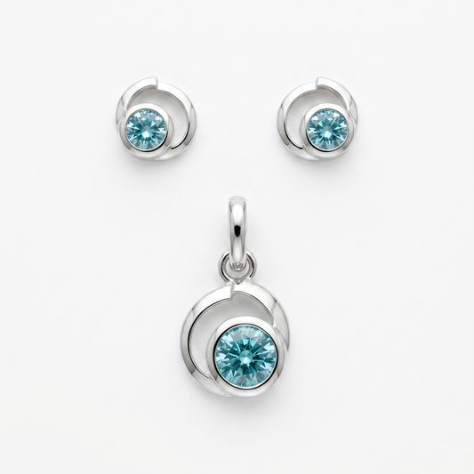 925 Silber Schmuckset mit Zirkonium Hellblau im Spiralen-Design – Anhänger und Ohrringe