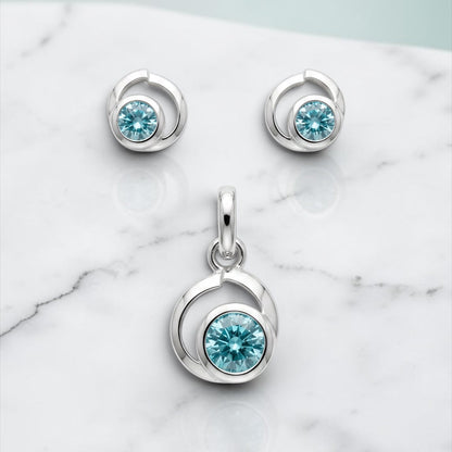 925 Silber Schmuckset mit Zirkonium Hellblau im Spiralen-Design – Anhänger & Ohrringe