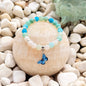 Blue Butterfly Natursteinarmband mit Crackle-Perlen in Blau und Mint auf Steinen